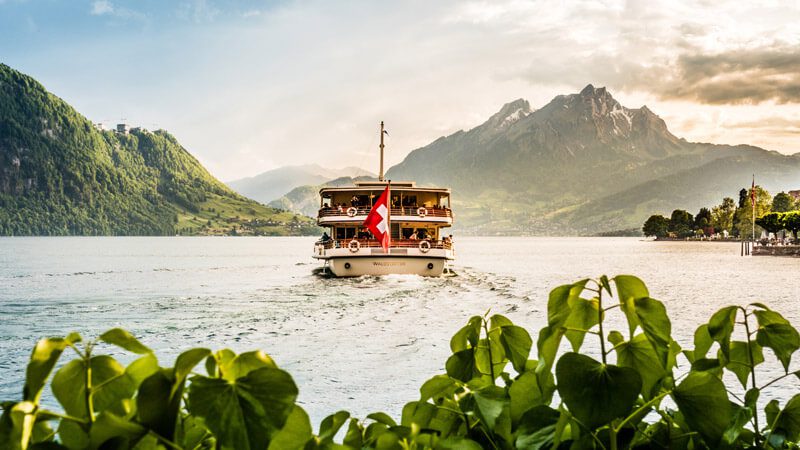 Why Switzerland Header Image - Boat on Lake Lucerne